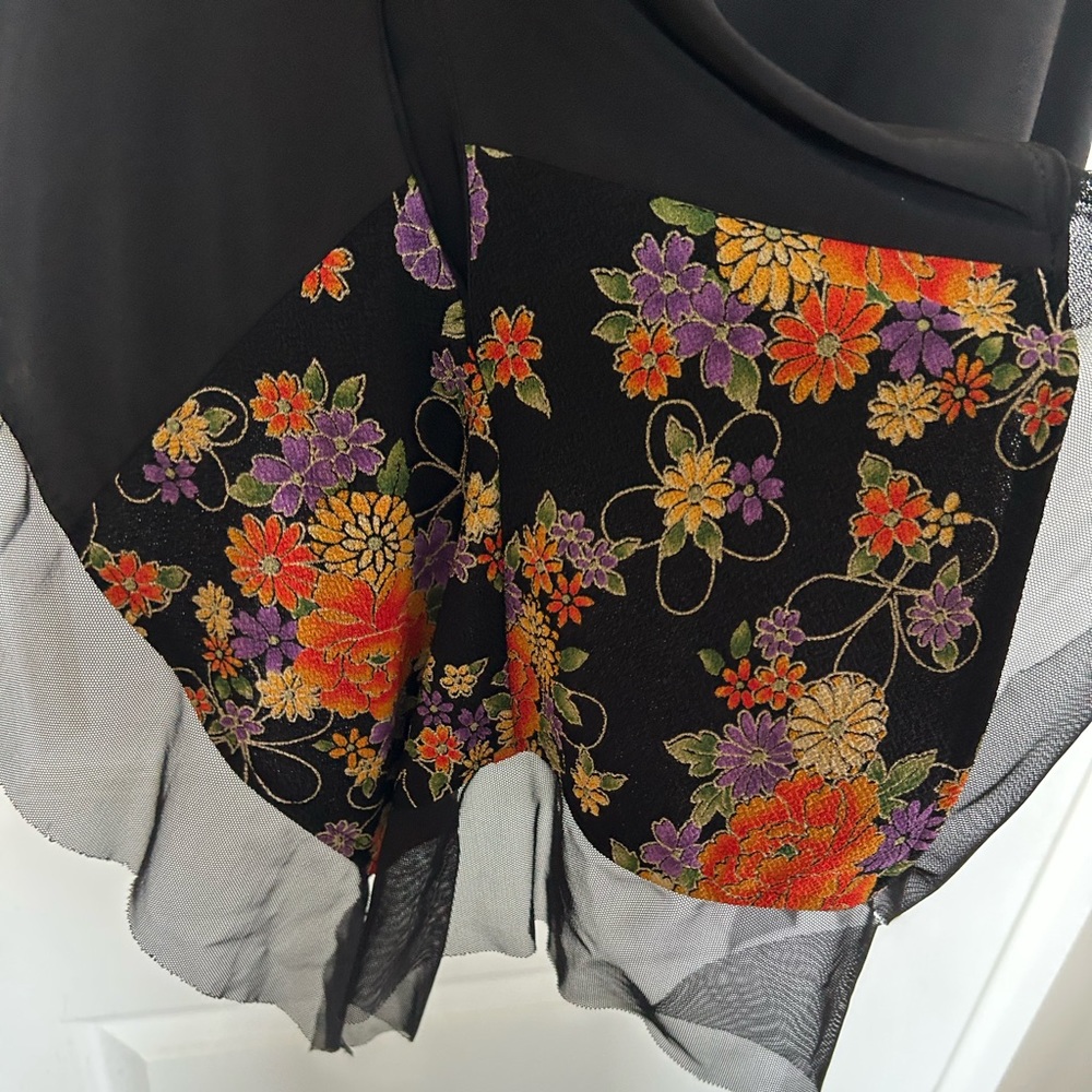 Black top with floral trim. - Picture 3 of 9